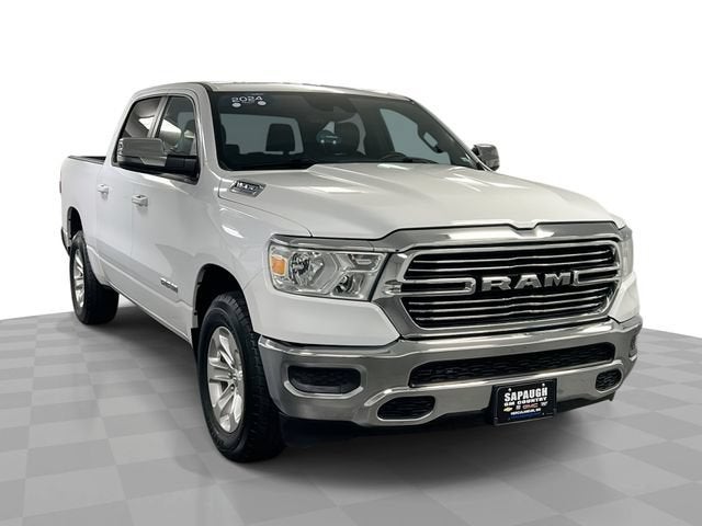 2024 RAM 1500 Laramie Crew Cab 4x4 5'7" Box in White — front three-quarter view