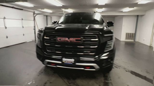 2025 GMC Yukon — rear three-quarter view