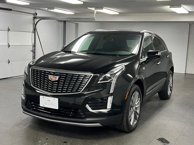 2024 Cadillac XT5 Premium Luxury in Stellar Black Metallic — front three-quarter view