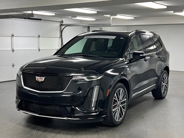 2023 Cadillac XT6 Sport in Stellar Black Metallic — front three-quarter view