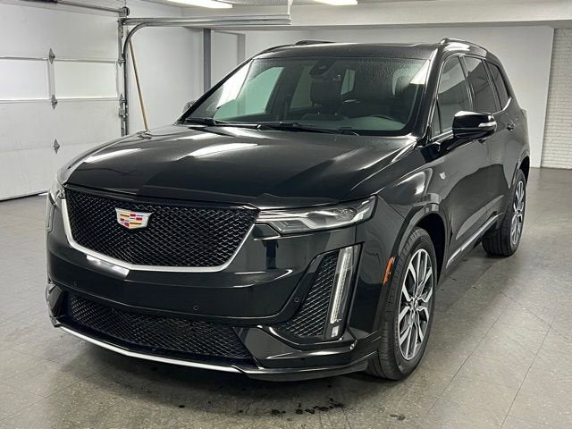 2024 Cadillac XT6 Sport in Stellar Black Metallic — front three-quarter view