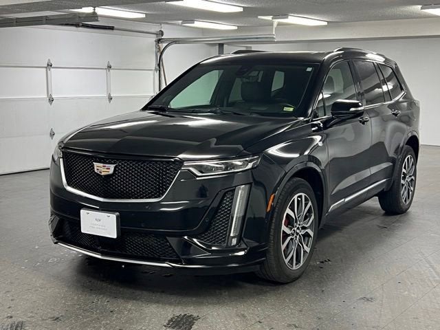 2023 Cadillac XT6 Sport in Stellar Black Metallic — front three-quarter view